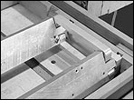 Aluminum bars and pivot arms of a neck duplicator