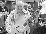 Ted Beringer displays one of his guitars