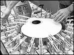 Daniel Fobert uses a series of clamps to glue a soundboard for a bouzouki