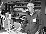 David Hurd displays some simple jigs for measuring properties of instrument tops at the 2006 GAL Convention