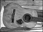 A badly damaged 1919 Santos Hernandez guitar