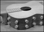 One side of the instrument contains manu soundport holes which can be opened or closed  using corks