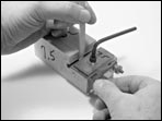 Adjusting a peg shaper.