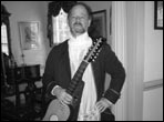 Kent LaRue in costume with baroque guitar