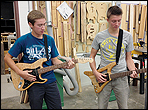 Kids building guitars in public school