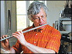 Olivier Fanton d'Andon playing a flute