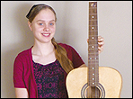 Amanda from the Waldheim School Industrial Arts shows her acoustic guitar.