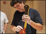 James Condino demonstrating how to hand rub a sunburst finish