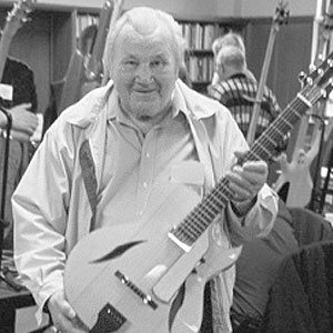 Picture of Ted Beringer  holding one of his guitars