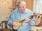 Picture of Ted Beringer playing one of his mandolins