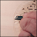 Ervin Somogyi shows how he carves a lute rose