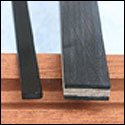 Carbon bar stock and wood sandwiched between carbon