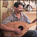 Blad Boujmaa holding a unfinished oud