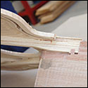 The top and main braces fit into the neck heel