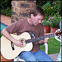 Rodney Stedall plays one of his own steel-string guitars