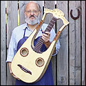 Wilfried Ulrich  holding a recent lyra guitar