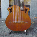 Front view of a Wappen-style contra guitar, circa 1900