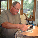 Randy Reynolds is measuring the double-top with a dial indicator