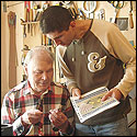 Dmitry Zhevlakov and his grandfather Vasilij inspect rosettes