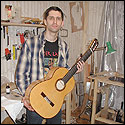 Dmitry shows the front of a 7-string guitar