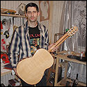 Dmitry shows the back of a 7-string guitar