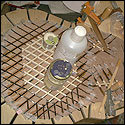 Jim Norris is gluing his balsa lattice on top of a crisscross layer of carbon fiber and epoxy