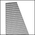 Shows how the fret tops look after approximate conical leveling