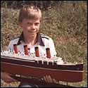 Rob Rodgers holding the steam powered RMS Mauretania built by David Rodgers