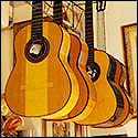 Recent guitars hanging in Andrea Tacchi’s shop.