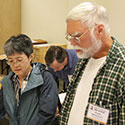 Don Bradley at the 2011 Guild of American Luthiers Benefit Auction preview, with Kathy Matsushita.