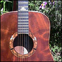 View of the soundhole and upper bout of a guitar by Don Bradley