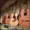 Guitars in the display room at the Lutherie Bordeaux shop.