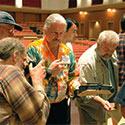 2011 convention goers taking phtos of Doug Martin's balsa violin