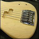 Kahler tremolo bass bridge installed on a unfinished bass guitar