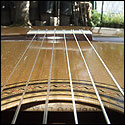 View from the soundhole of the bridge on a 1930 Santos Hernandez guitar