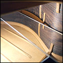 Using a mirror to see the fan bracing on the soundboard of a 1930 Santos Hernandez guitar