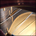 Using a mirror to view the other side of the fan bracing on a 1930 Santos Hernandez guitar