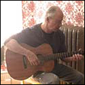 Paul Buck plays a guitar by Mike Mahar.