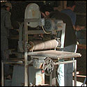 Students working on their instruments in the shop at the Roberto-Venn School