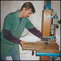 Robbie O'Brien cutting some wood on a bandsaw