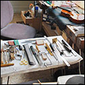 Olivier made room in his shop for a recent graduate from violin making shool to work on her own instruments