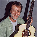 Steve Klein holding a acoustic guitar by Josep Melo