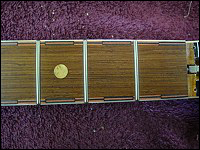 View of fancy fretboard purfling near the nut.