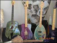 Four ceramic bodied guitars